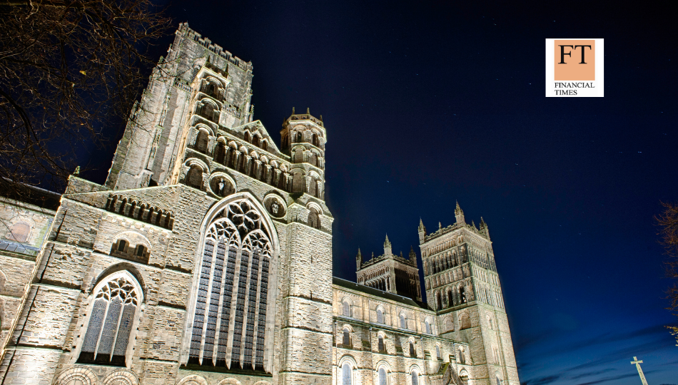 Durham Business School Building at night with financial times logo