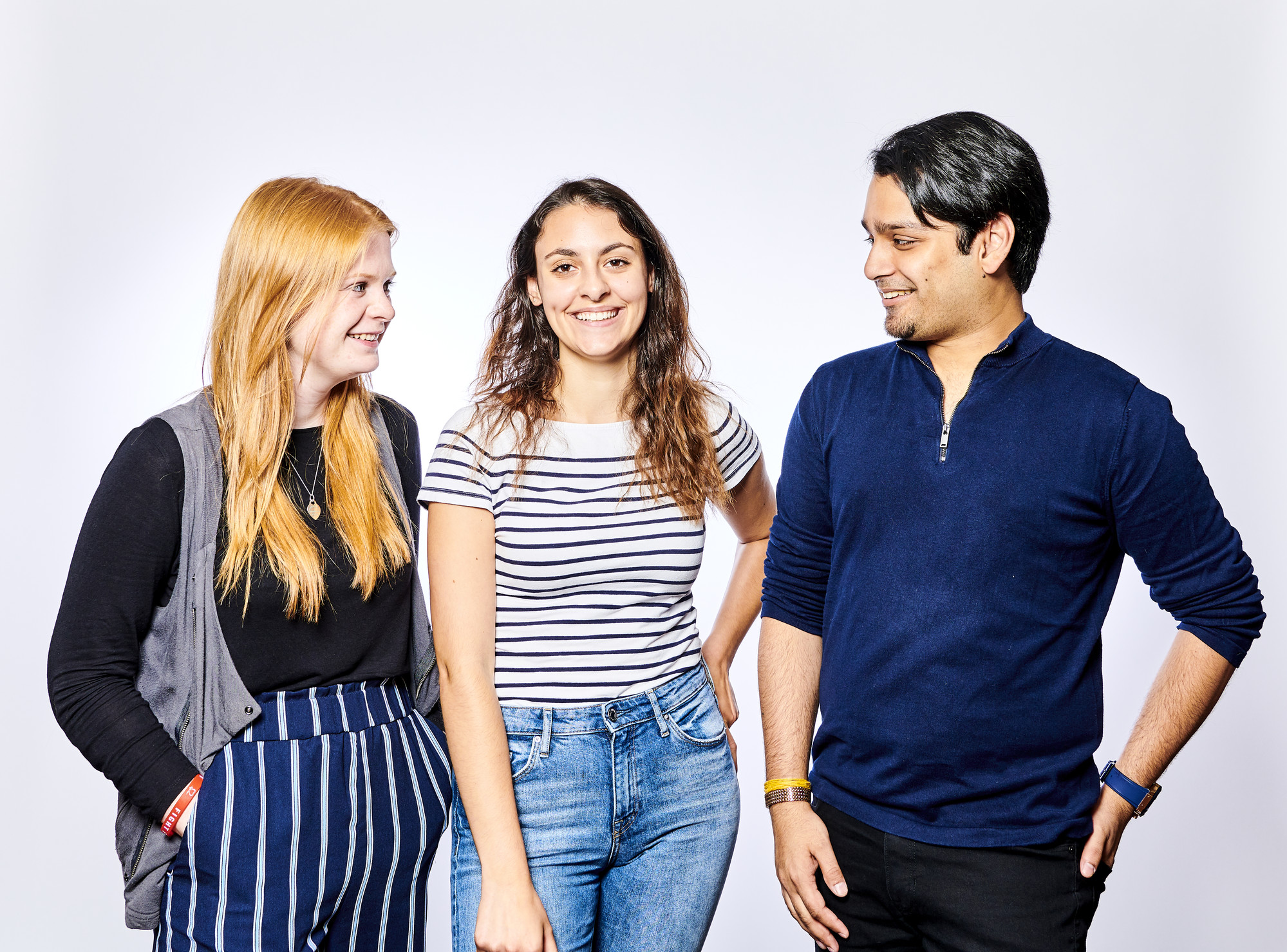Three students smiling