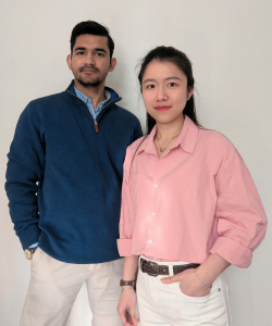 Debtanu Das in a navy top standing next to cofounder Trang Phan in a pink top