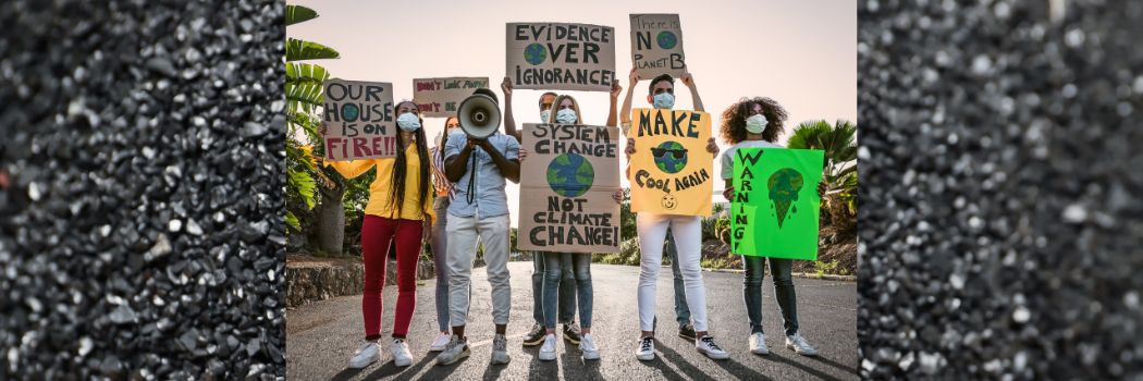 People holding environmental placards