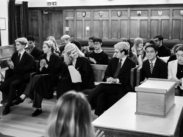 Our four finalists getting ready to present their cases in front of the student jury. Two advocates for the prosecution and two for the defence.