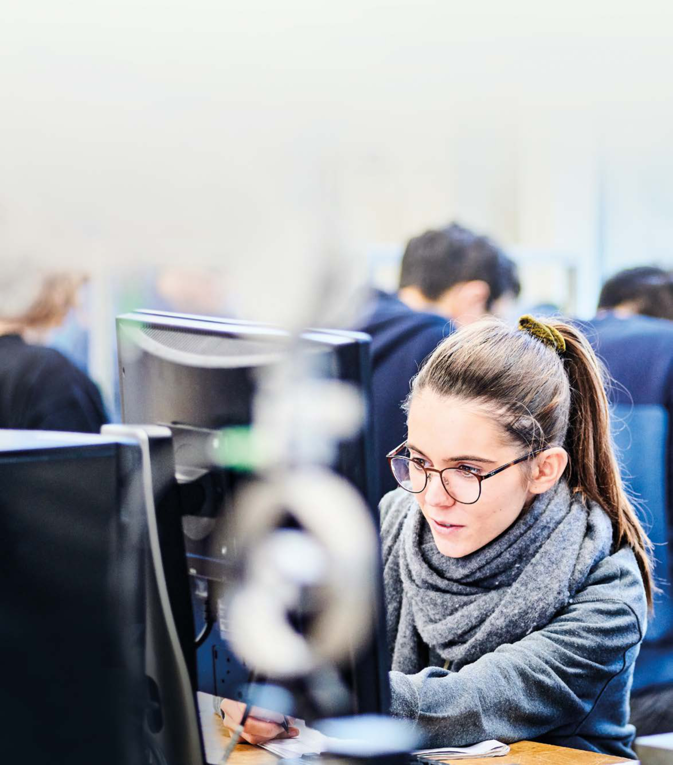 Student sitting at a computer studying