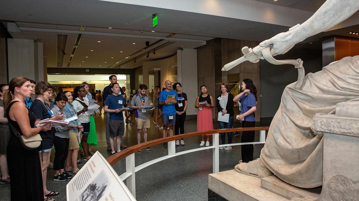 A group of people viewing a museum exhibit