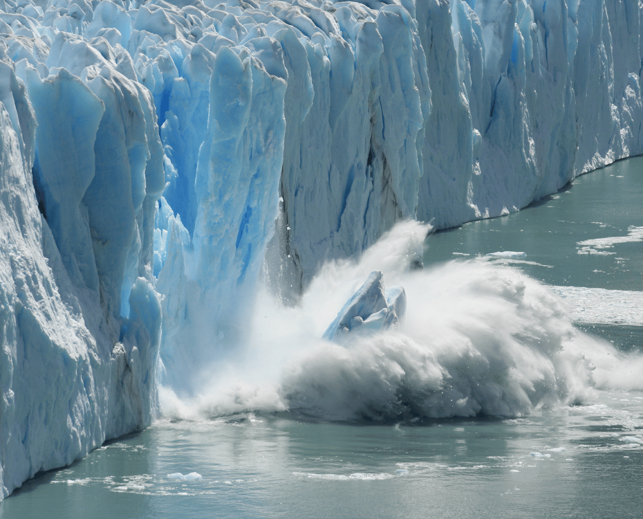 Iceberg cracking and falling into the water