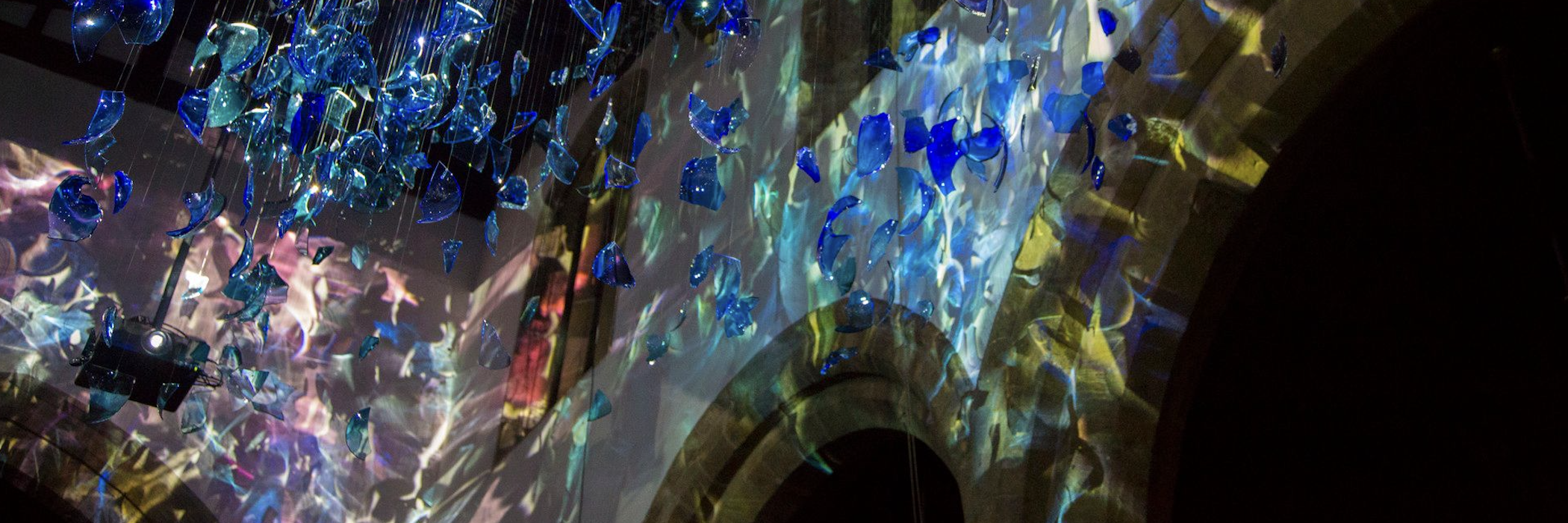 Glass birds against an archway