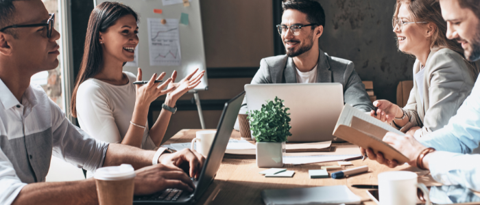 Business people work together around a table