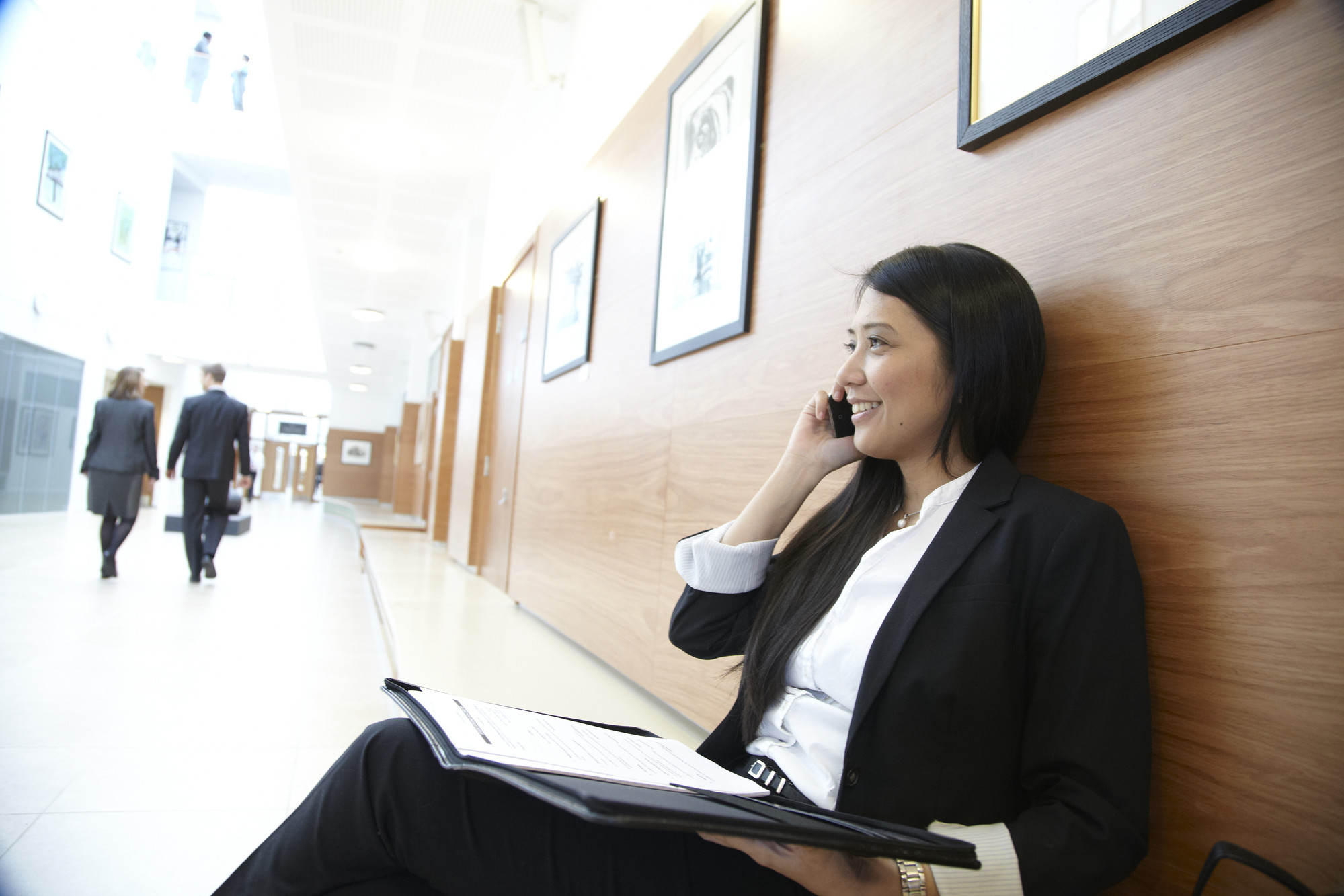 Business woman on phone with notes