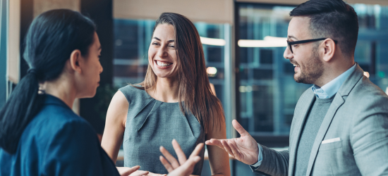 Professionally dressed students chatting or networking