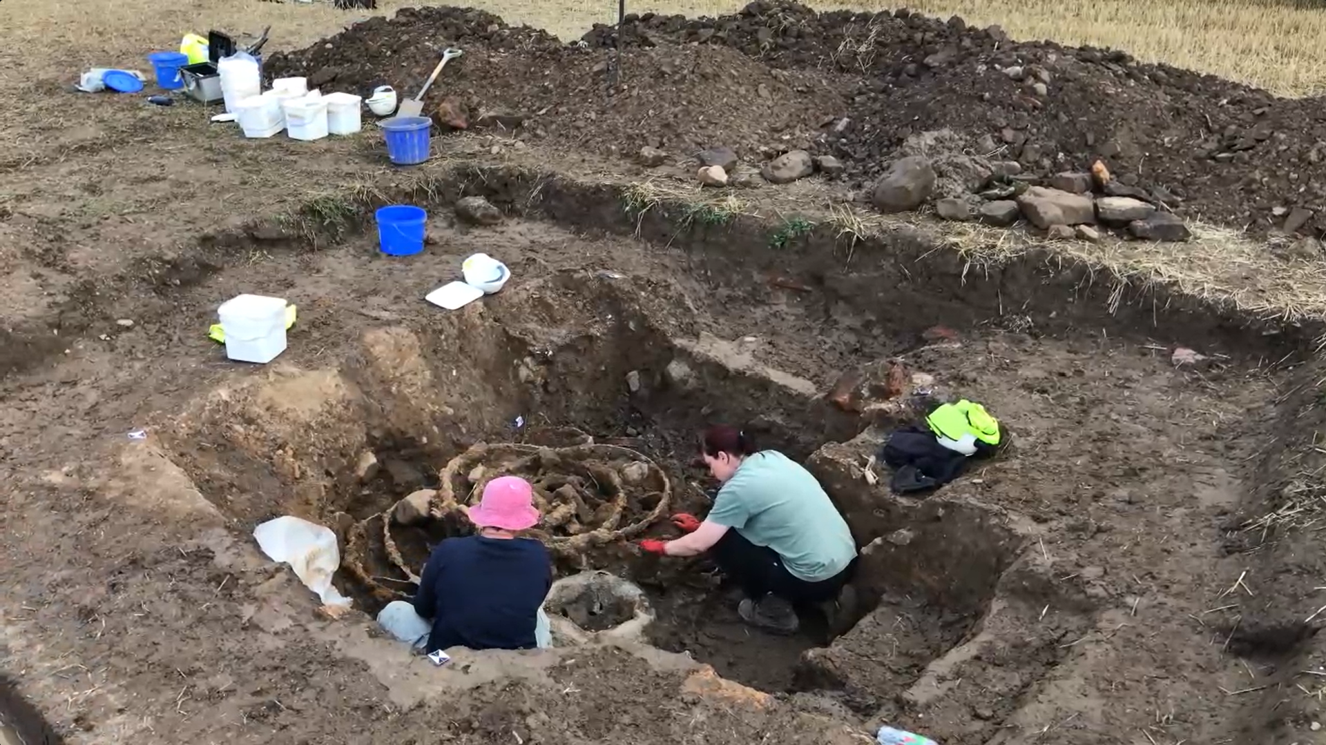 Two people excavating The Melsonby Hoard