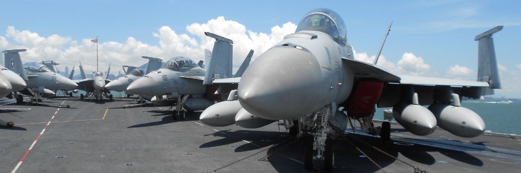 Military fighter jets on an aircraft carrier