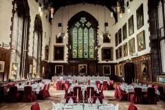 Wide shot of the Great Hall with tables dressed for dinner