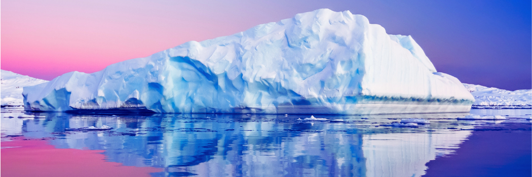 Antarctic ice sheet reflecting on clear water