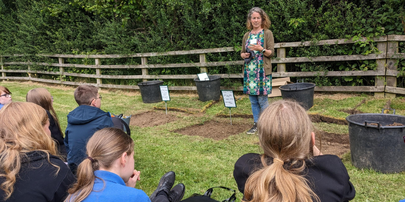 Professor Karen Johnson talks to pupils about soil health in our Botanic Garden