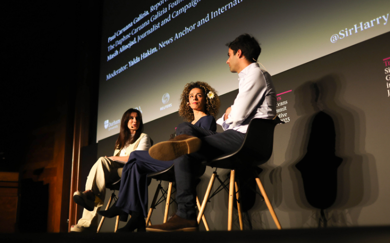 Panel of journalists onstage at the Sir Harry Evans Summit