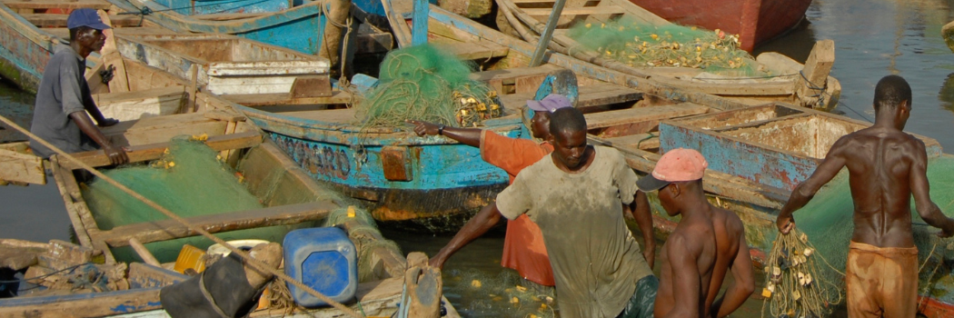 Men working at a Ghanaian fishing port