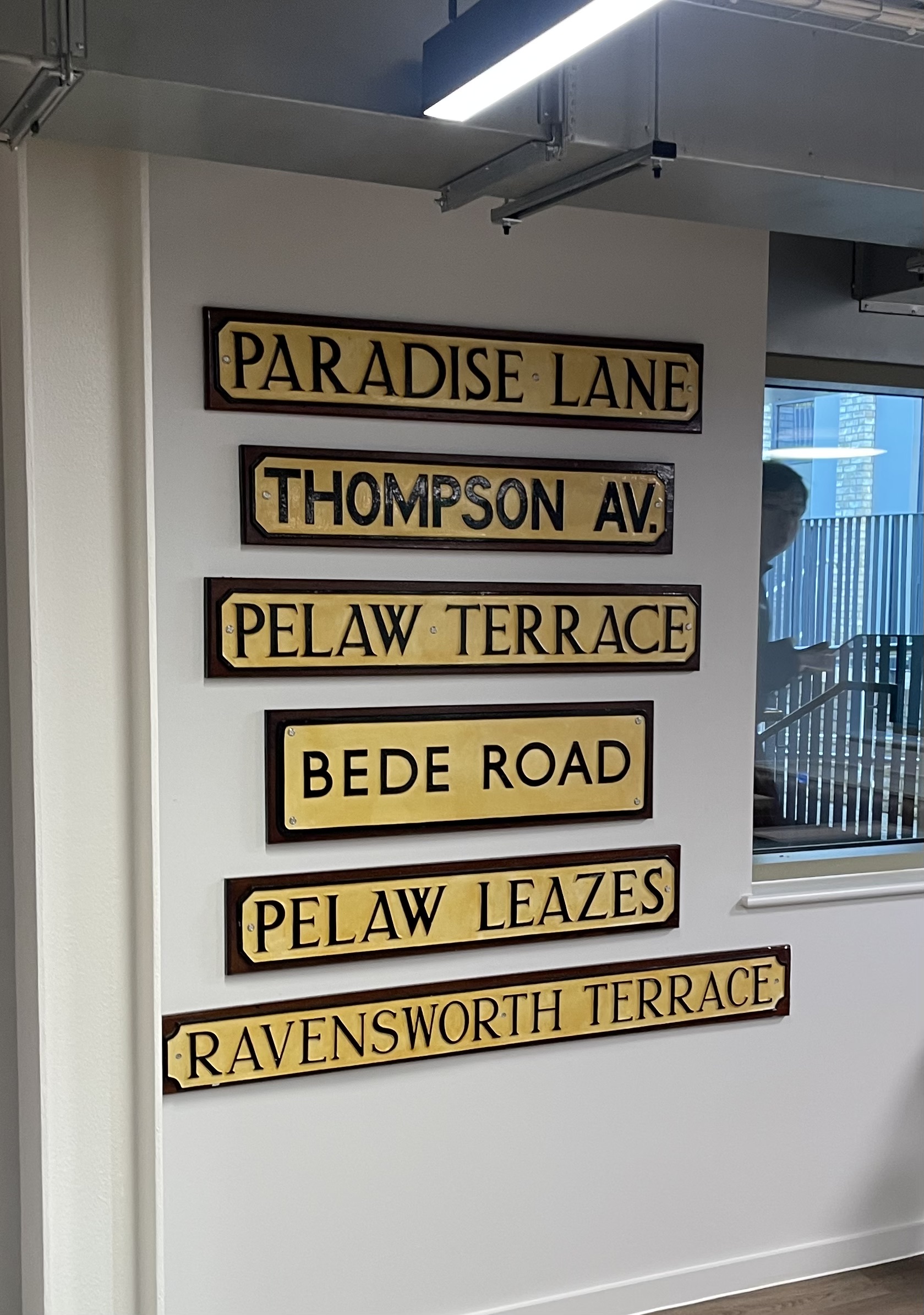 Street signs from roads where the College has had property