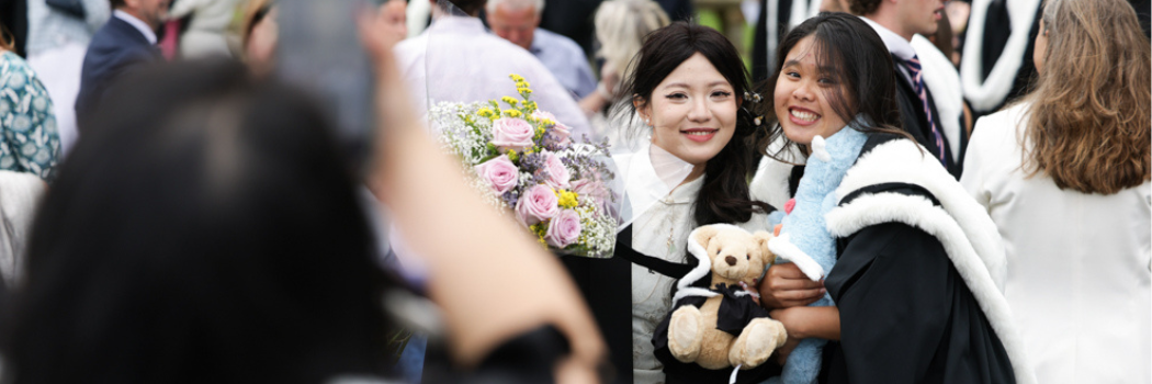 Graduates with teddy