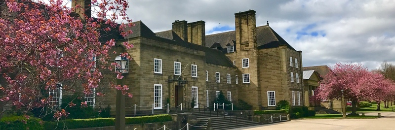 An image of St Mary's College in the Spring. The building is a Neo-classical style in grey.