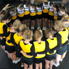 Cheerleaders in a huddle