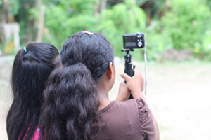 Two people using a camera