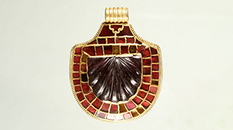 A decorative red jewelled pendant