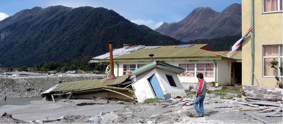 Person looking at aftermath of earthquake