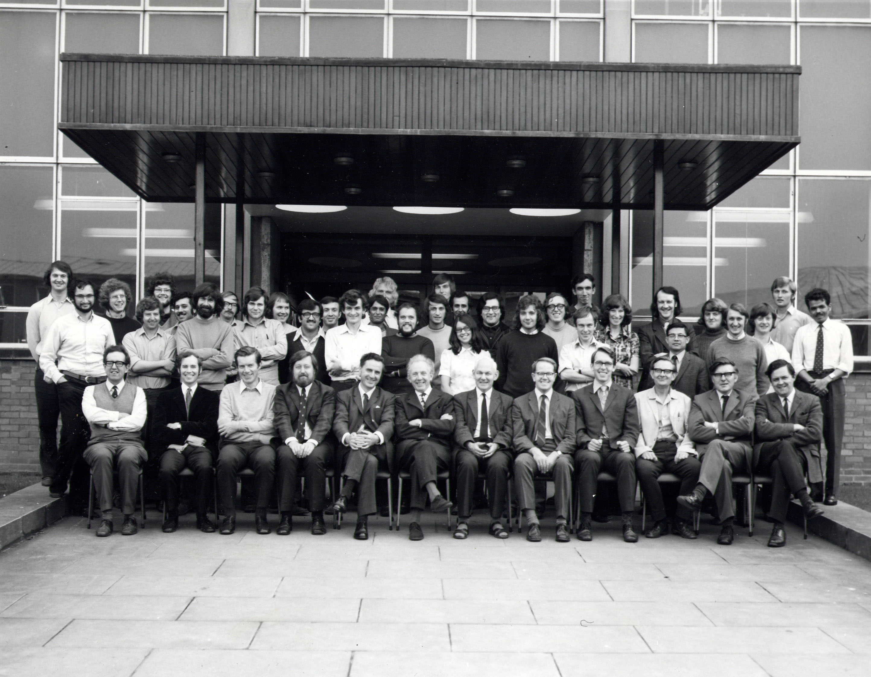 Group photo of staff outside the department entrance in 1973