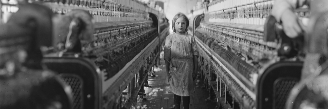 Image of a young child in a cotton mill factory setting