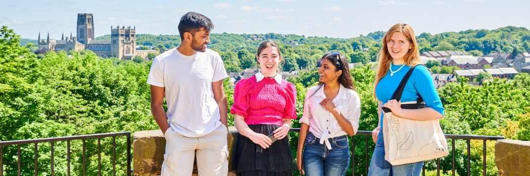 A group of students with the Durham landscape in the background