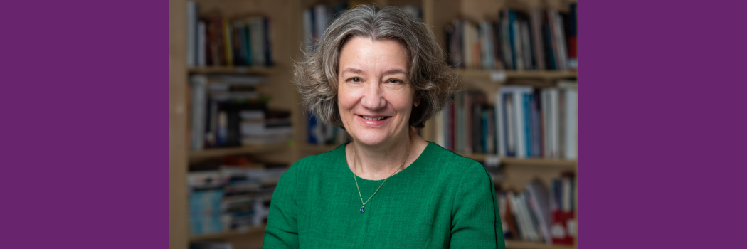 Vice-Chancellor Karen O'Brien is pictured centre with bookcase in background