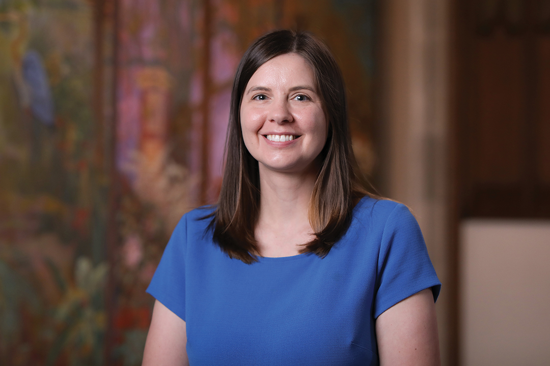 A smiling woman with long brown hair