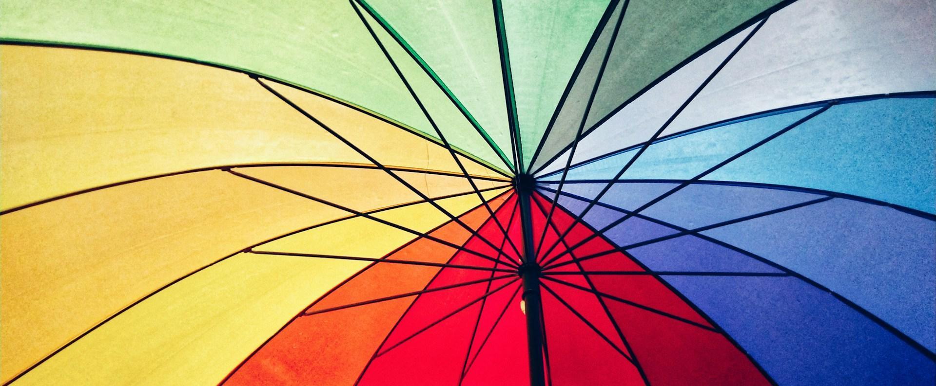 The underside of a colourful umbrella