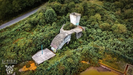 An Ariel view of a colliery surrounded by green trees