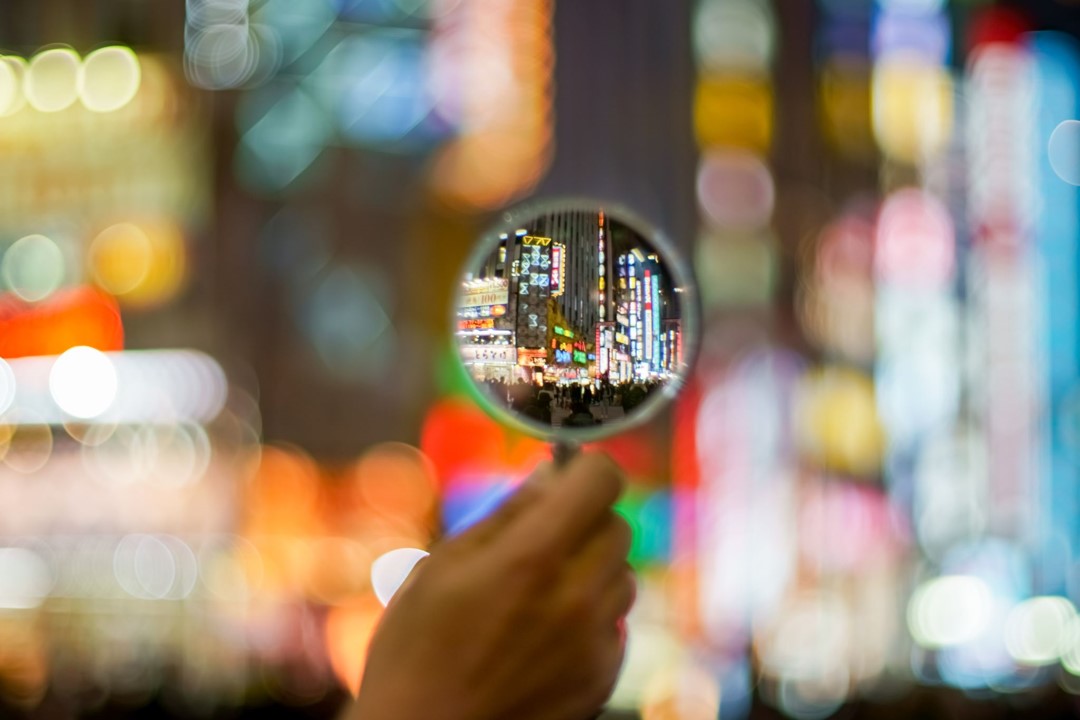 TA city street seen through a magnifying glass, with the background blurred out